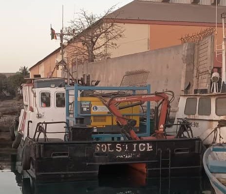 The Solstice, a catamaran workboat with a deck crane, alongside in Dakar